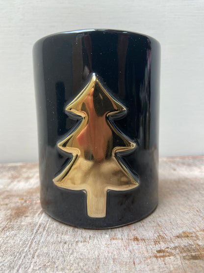 Zwarte kandelaar met gouden kerstboom