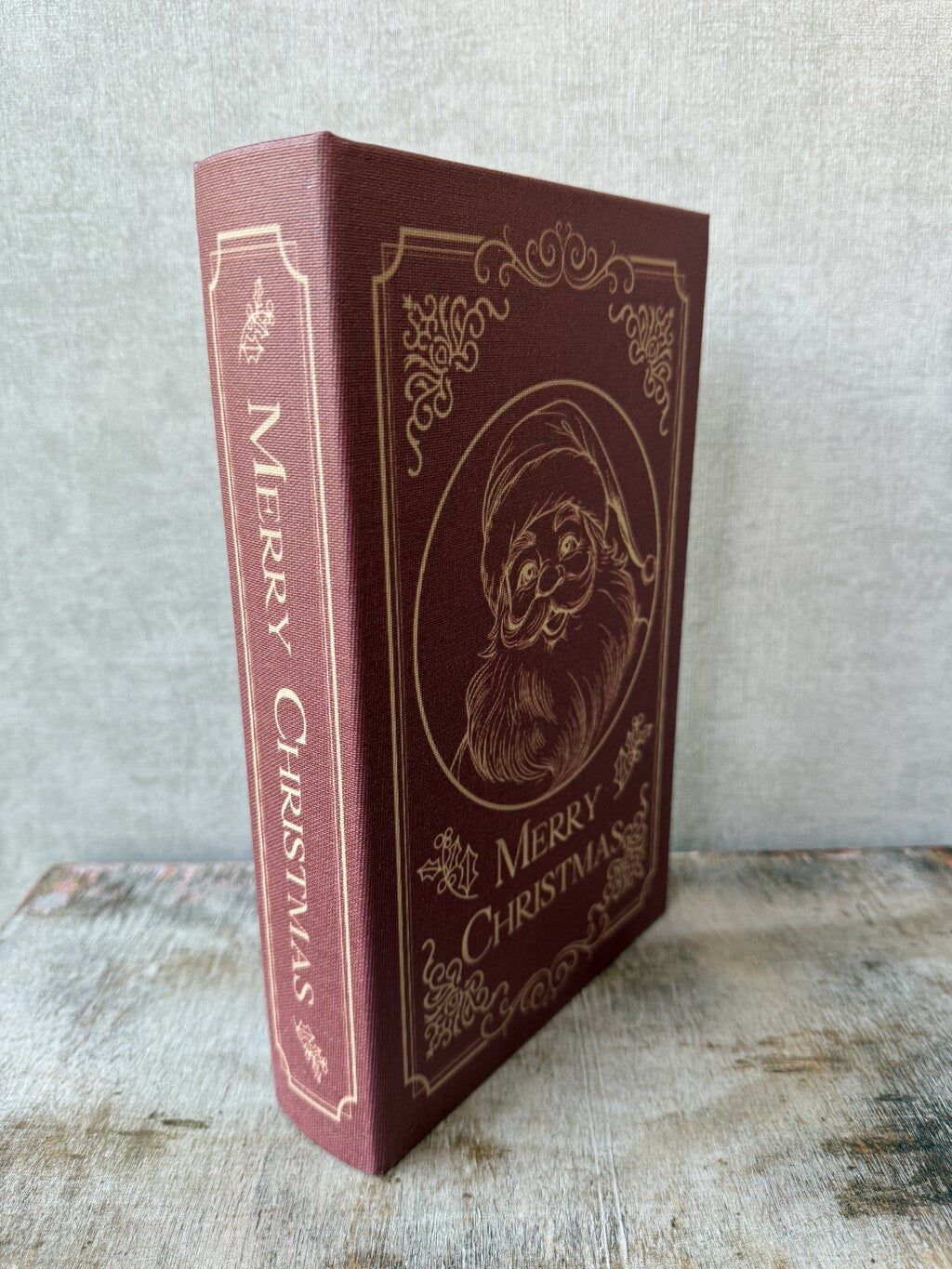 Rood Opbergboek Santa van HomeBound met gouden kerstman en Merry Christmas opdruk.