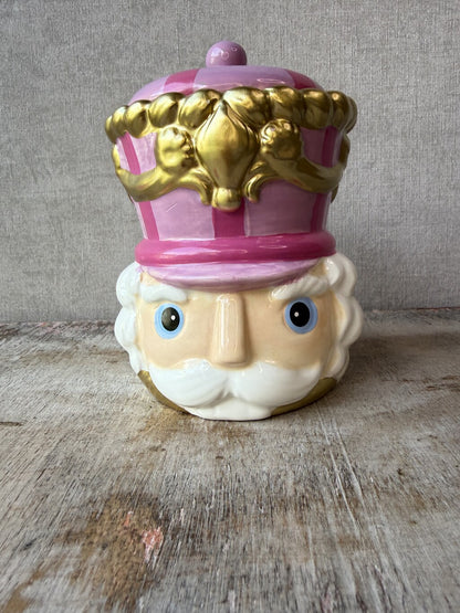 Roze keramieken voorraadpot Notenkraker met gouden details en deksel.